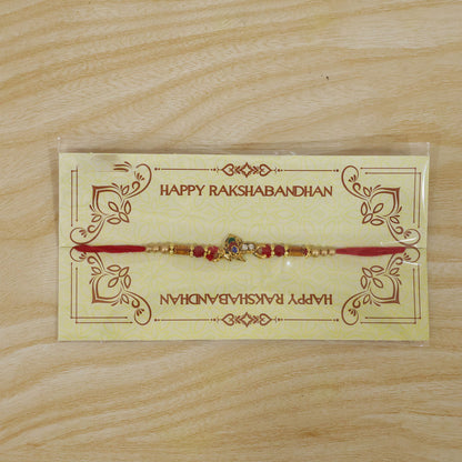 Peacock Floral Crescent Rakhi with Antique Gold Centre, Color Stones and Red Thread