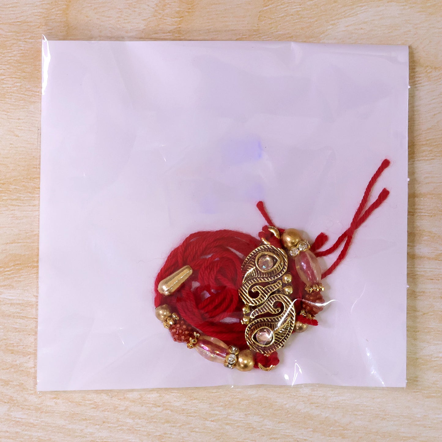 Antique Twin Paisley Kairi Motif Kundan Rakhi with Rudraksha & Crystal Beads