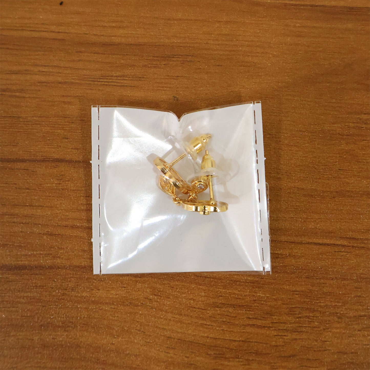 Elegant Gold Paisley Drop Earrings with Ruby Accent