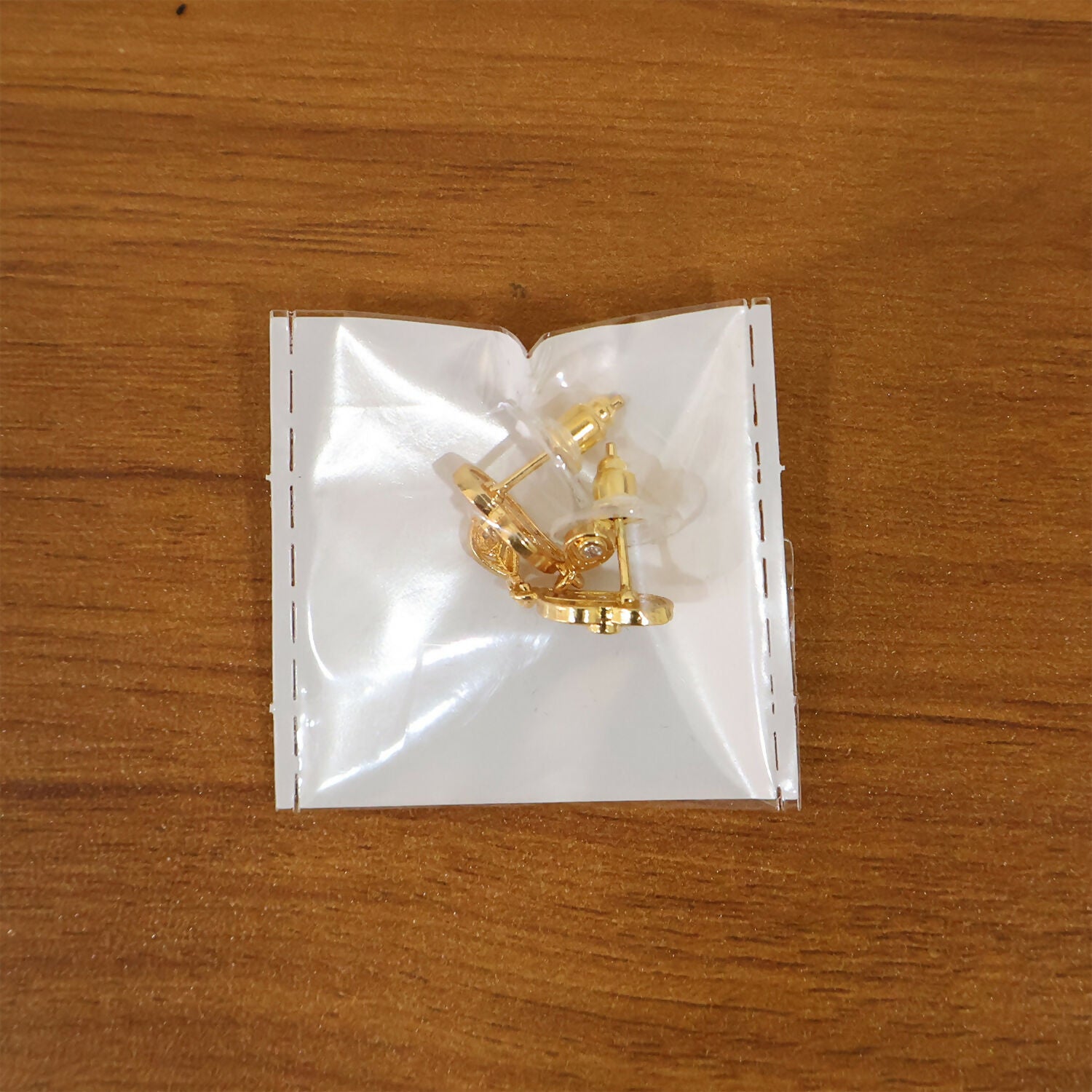 Elegant Gold Paisley Drop Earrings with Ruby Accent