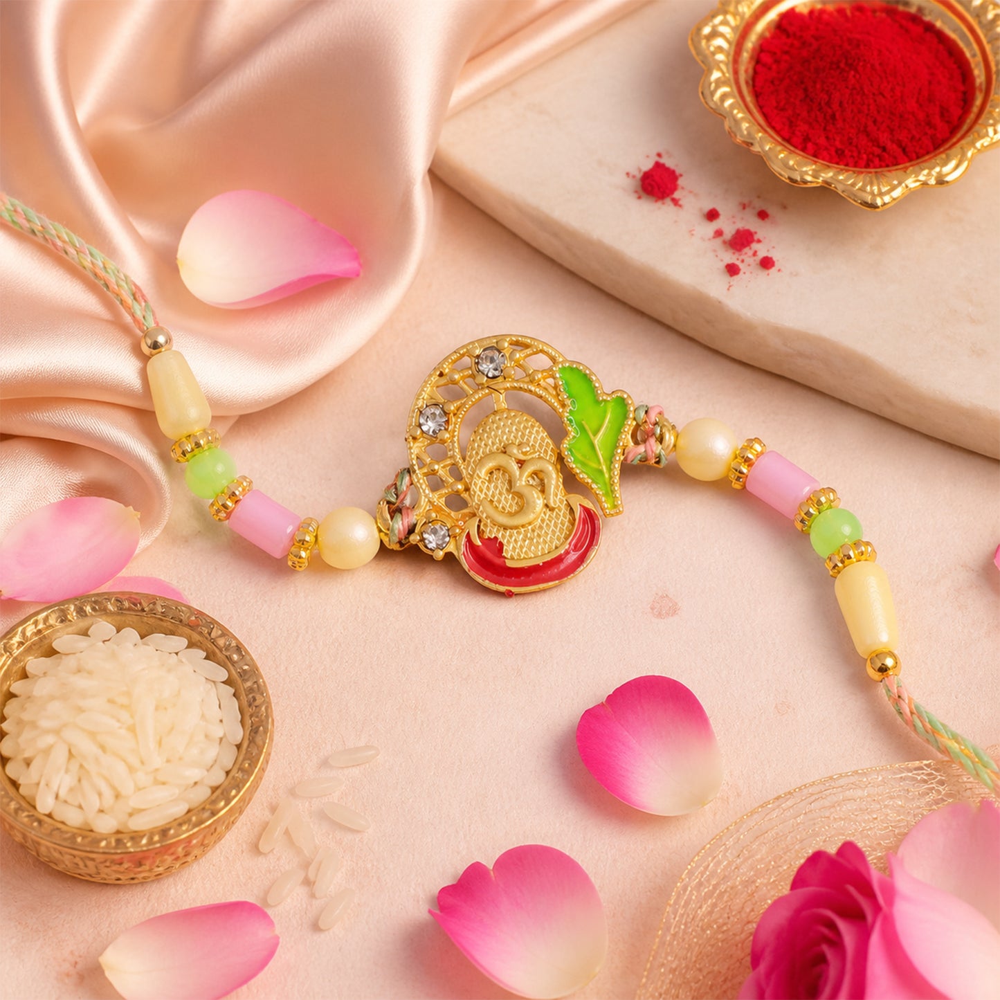 Textured Gold Om Pendant Rakhi with Leaf Accent and Pearl Beads
