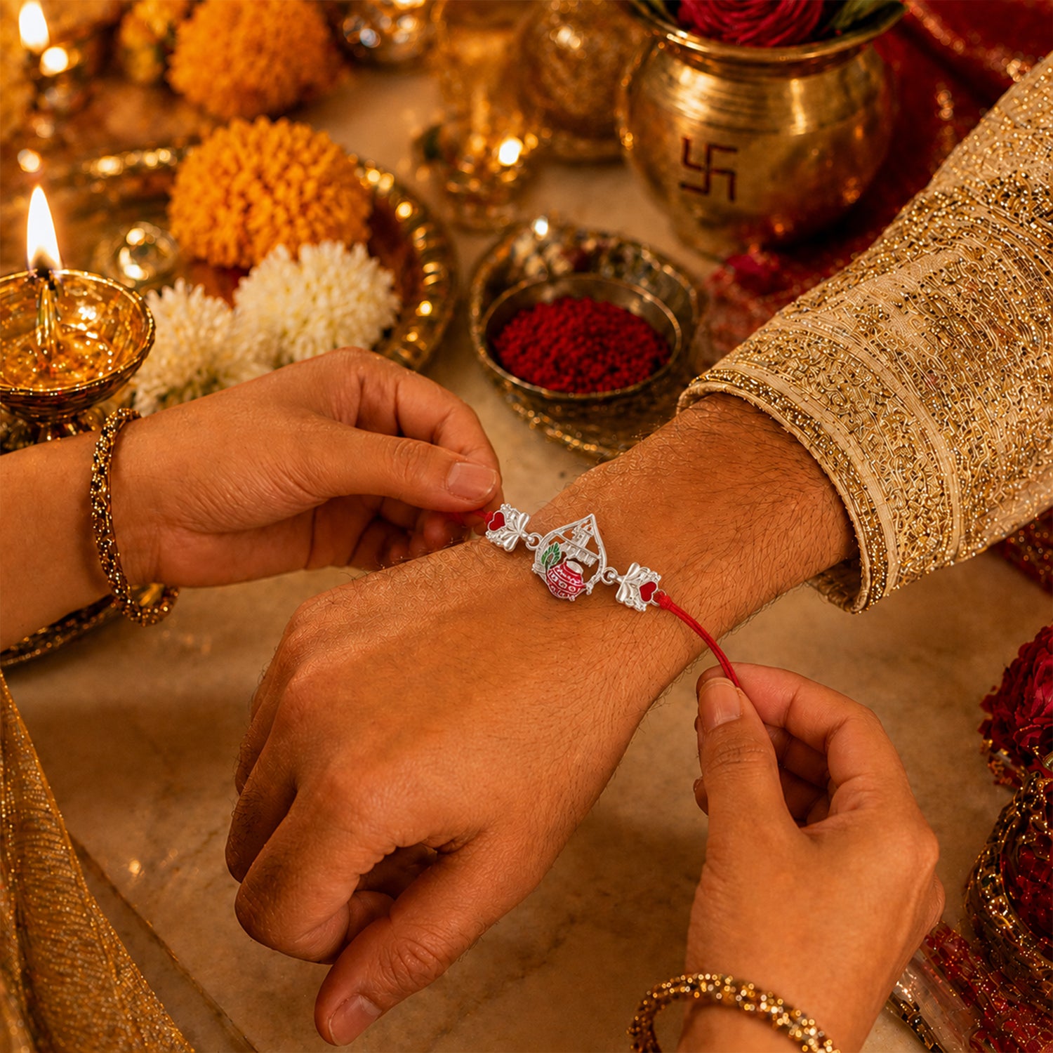 Silver Crown Rakhi with Pink Stone Center and Red Mauli Thread