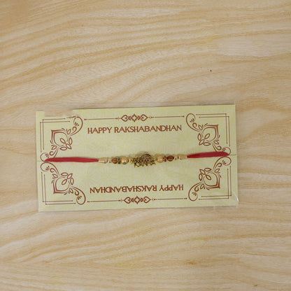 Kanha Krishna Devotional Rakhi with Peacock-Flute Style Golden Centre and Red Beads