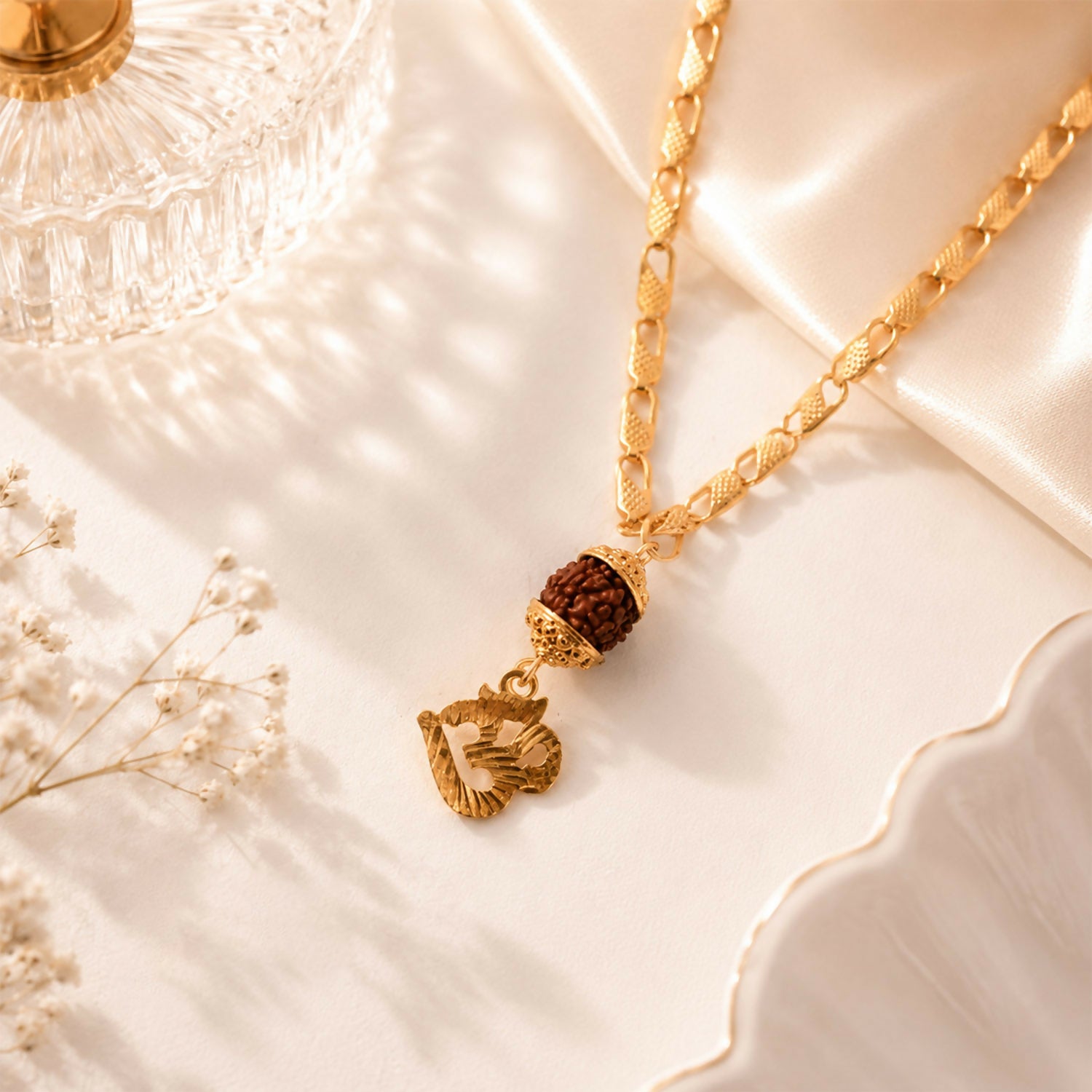 Beautifully crafted gold finish Rudraksha and Om pendant on chain