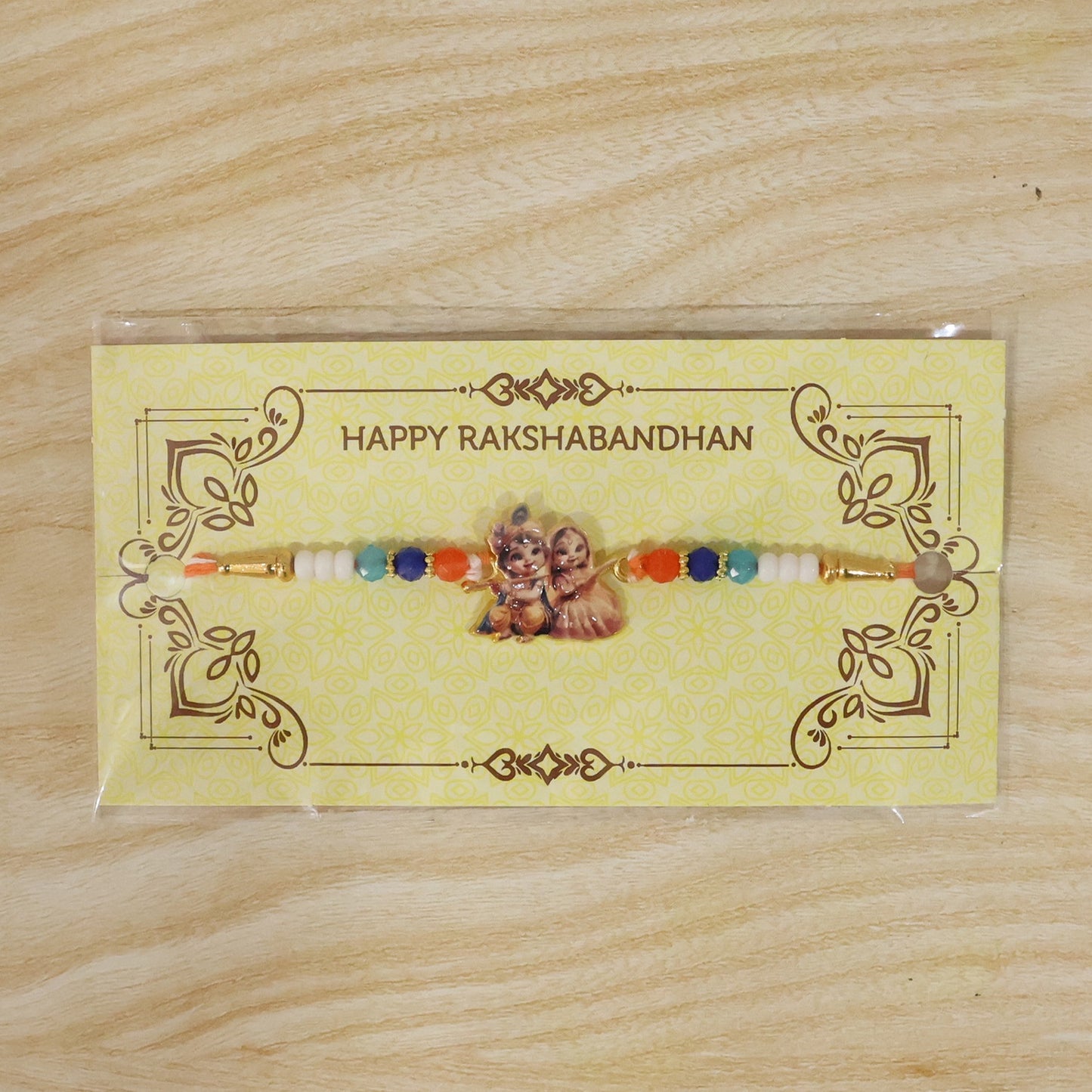 Decorative Rakhi featuring Radha Krishna motif for festival