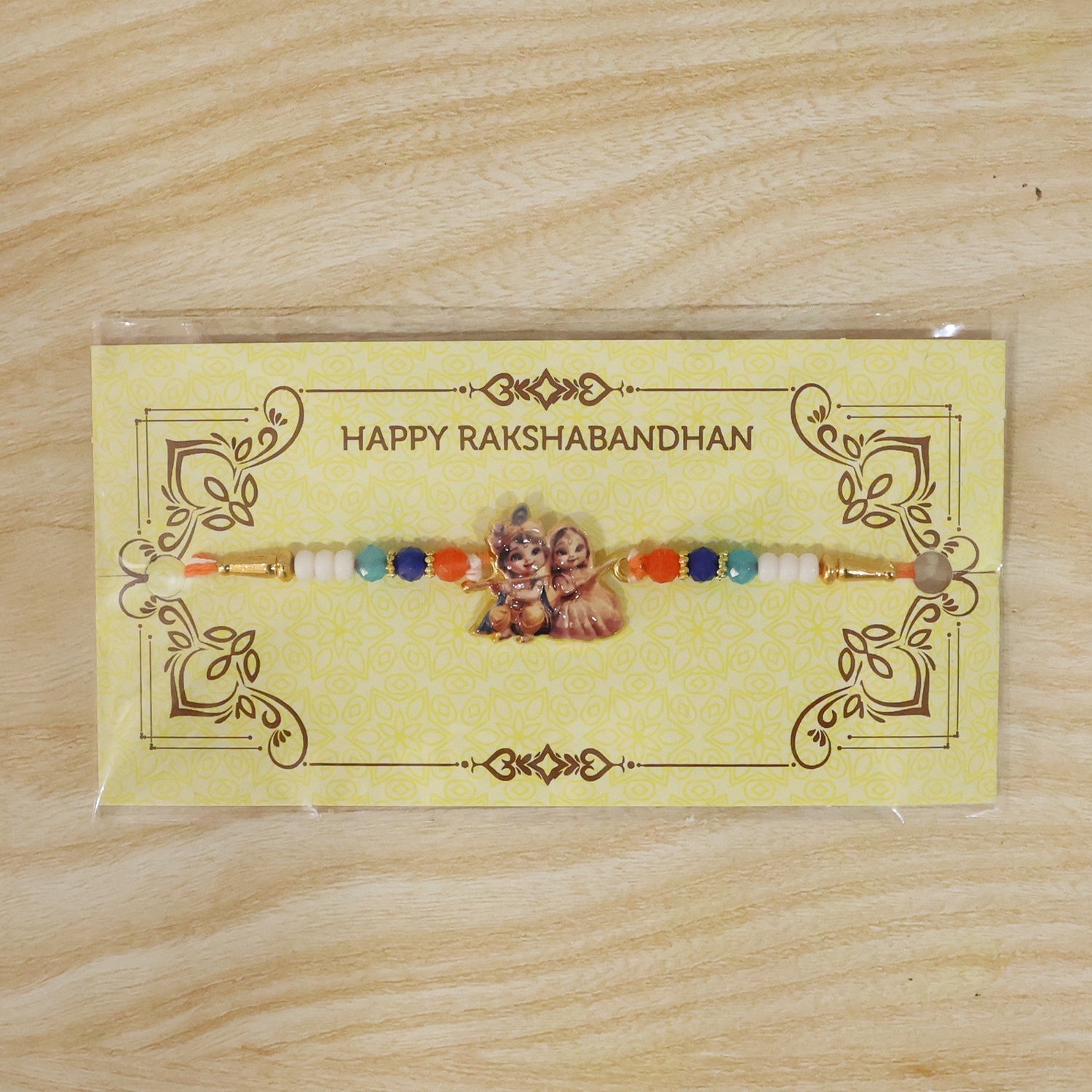 Decorative Rakhi featuring Radha Krishna motif for festival