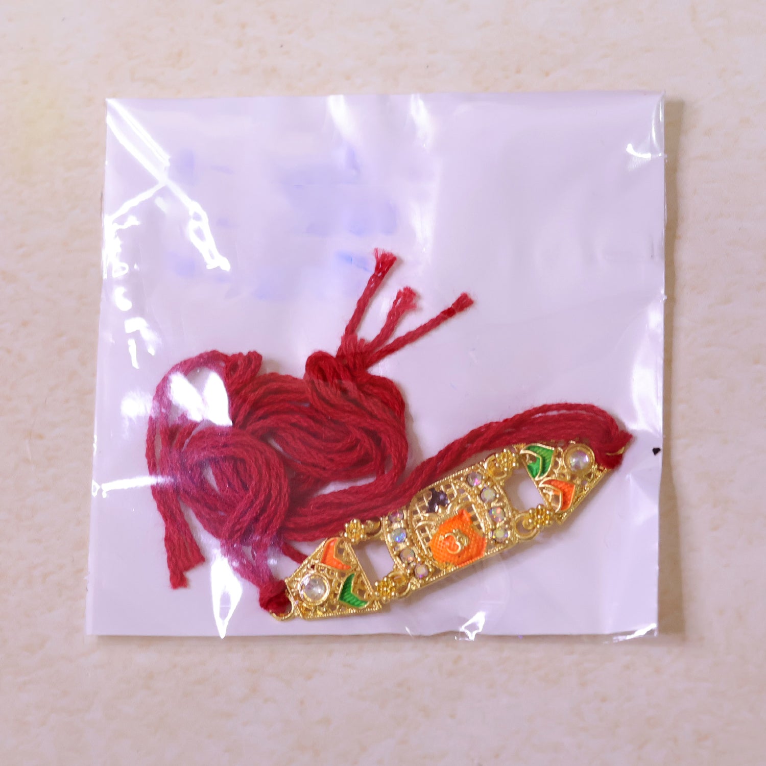 Premium Rakhi with Ornate Rectangular Plaque, crystal borders and chain look for Gift