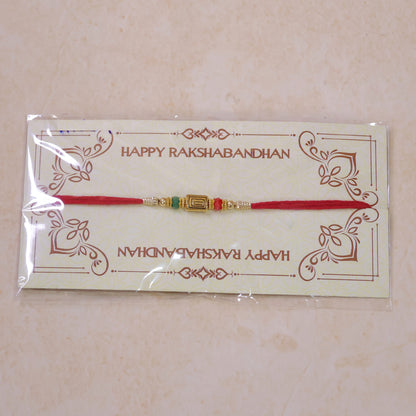 Red Thread Rakhi with Carved Golden Rectangular Charm Pendant