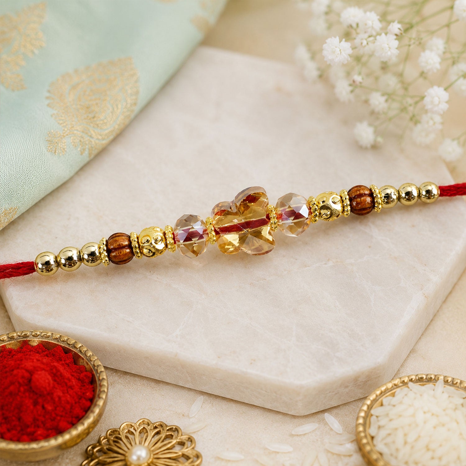 Crystal Flower Cluster Rakhi with Faceted Stones, Golden Accents and Red Thread