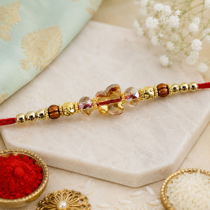 Crystal Flower Cluster Rakhi with Faceted Stones, Golden Accents and Red Thread