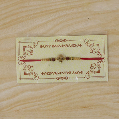 Ganesh Ji Antique Golden Devotional Rakhi with Red Beads and Pearl-Style Accents