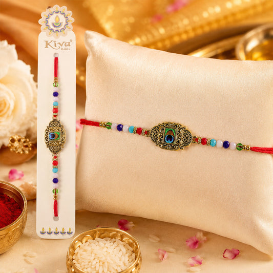 Antique Gold Blue Peacock Stone Designer Rakhi with Multicolor Beads, Roli Chawal Coin and Diya Packing