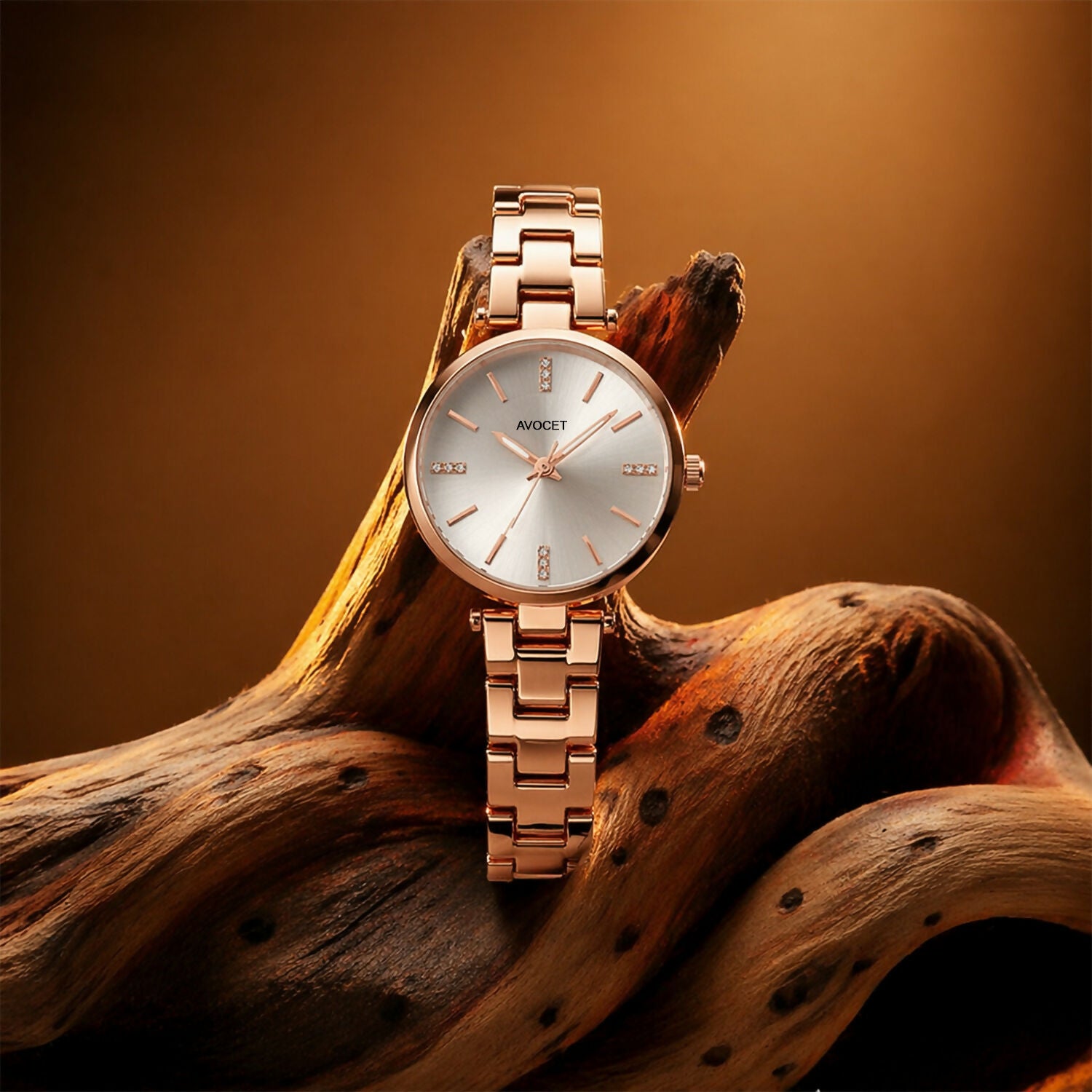 Rose gold analog watch displayed on white background