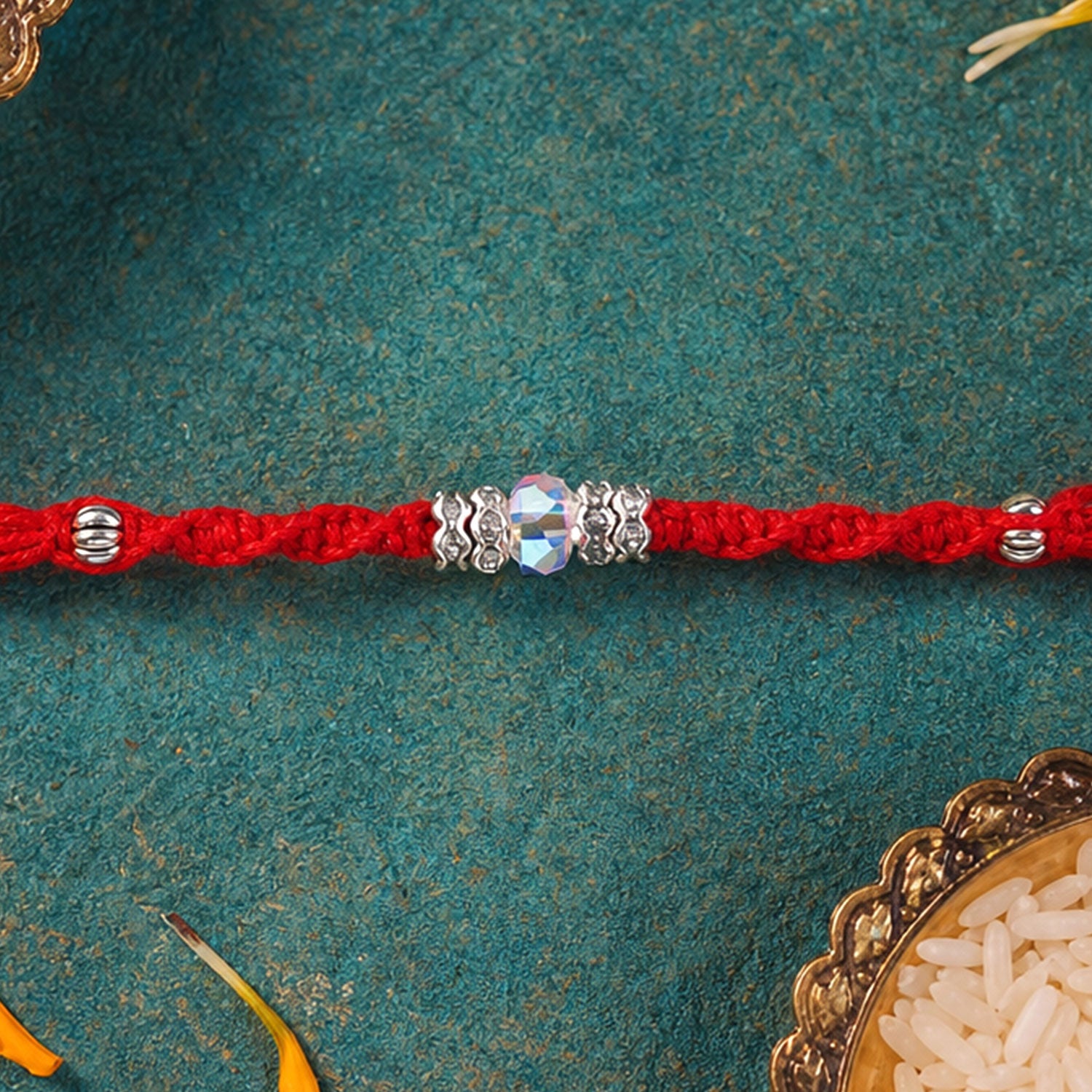 Red Braided Rakhi with a Row of Sparkling Crystal Bead Accents