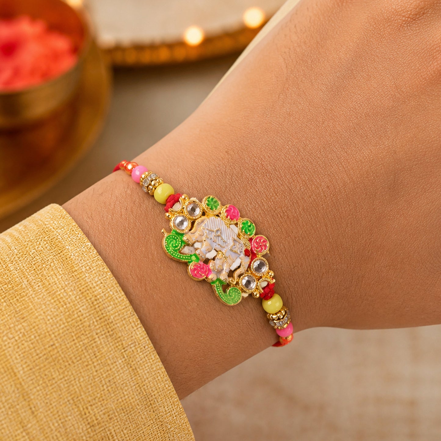 Festive Rakhi featuring Elephant Charm and gold trims in display look for Gift Use