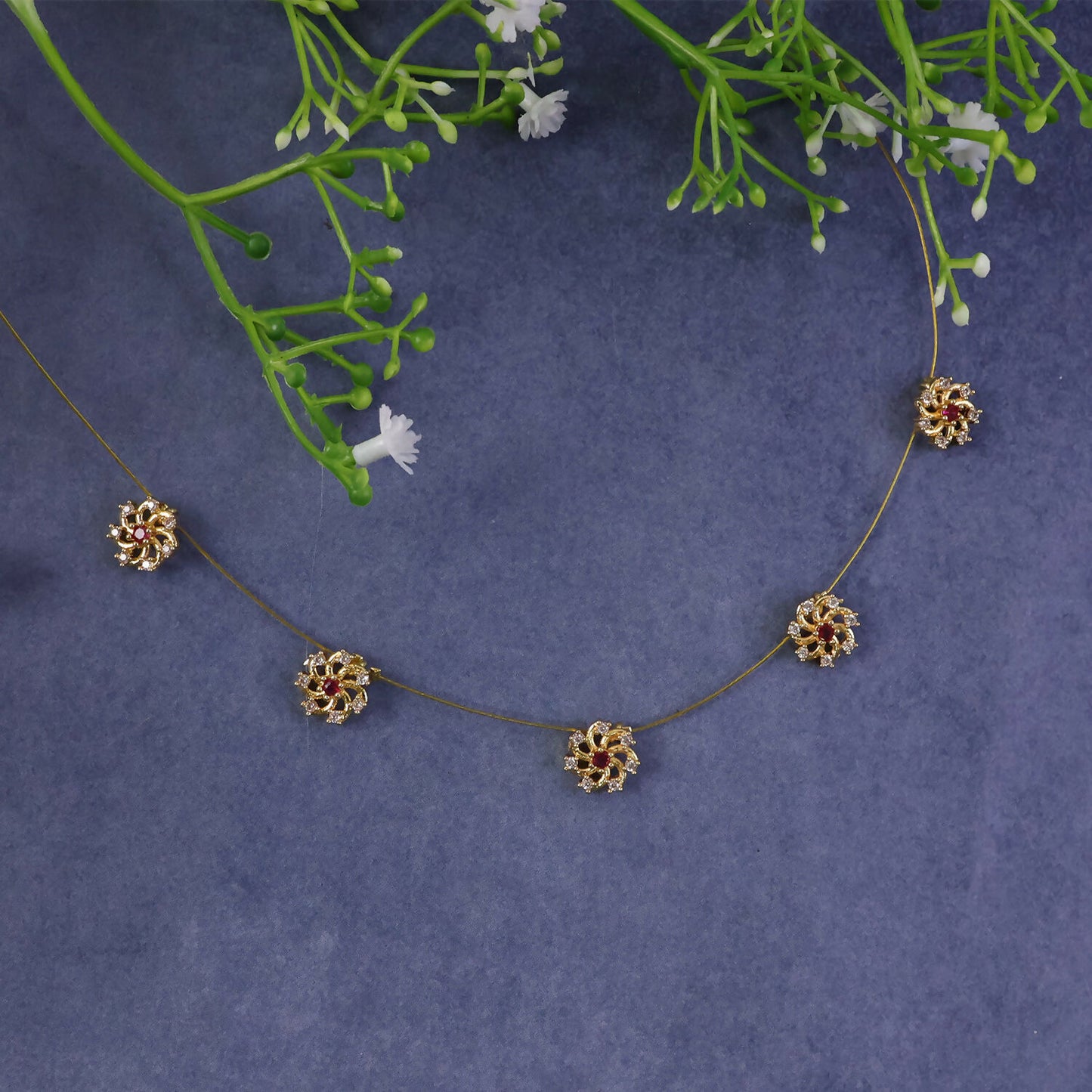 Ruby Floral Station Necklace with Diamond Detailing and Elegant Gold Chain Design