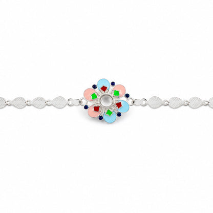 A silver chain rakhi with a colorful enamel flower charm centered on a plain white background.