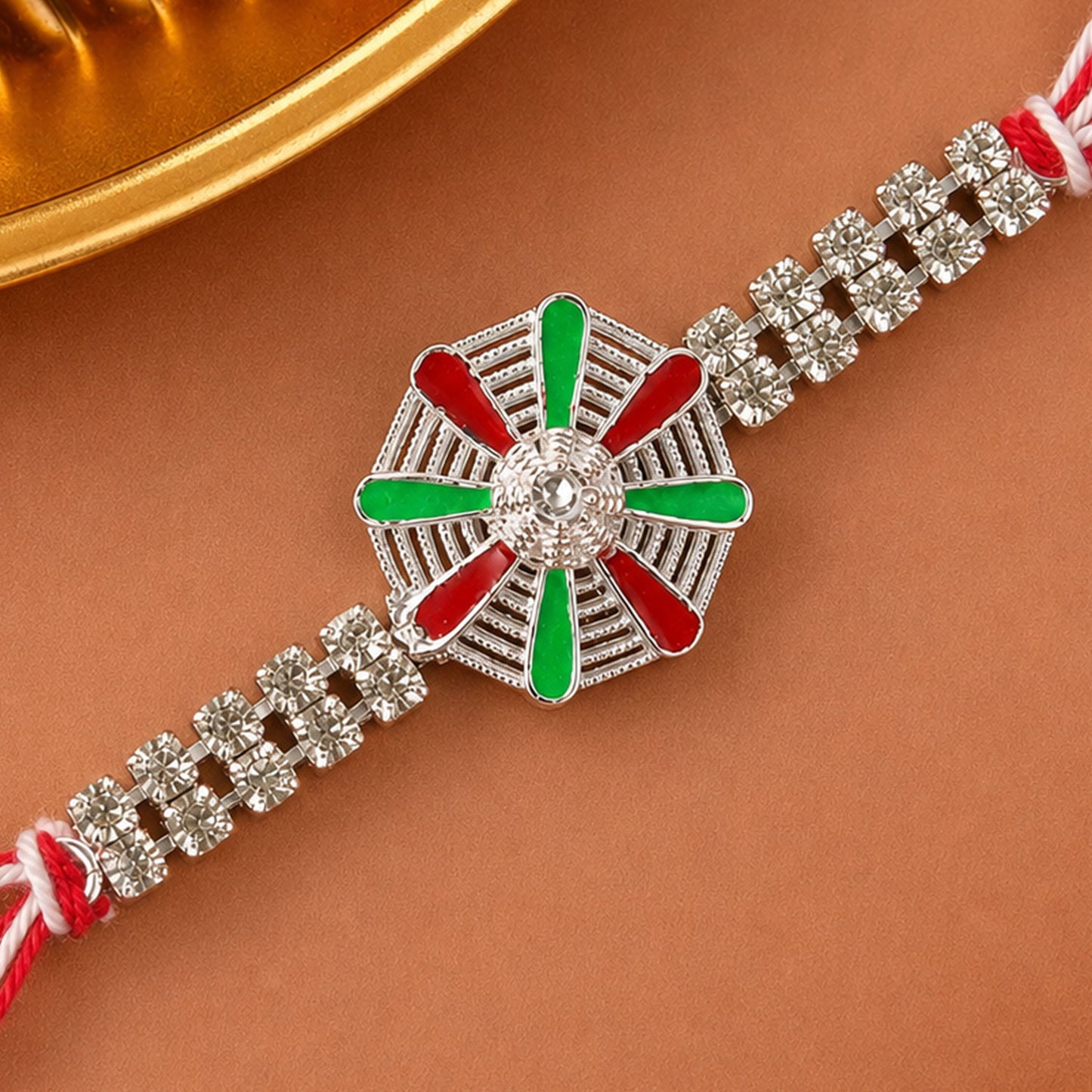 Elegant Rakhi showcasing Chakra Wheel Charm, crystal accents and wrist style for Gift