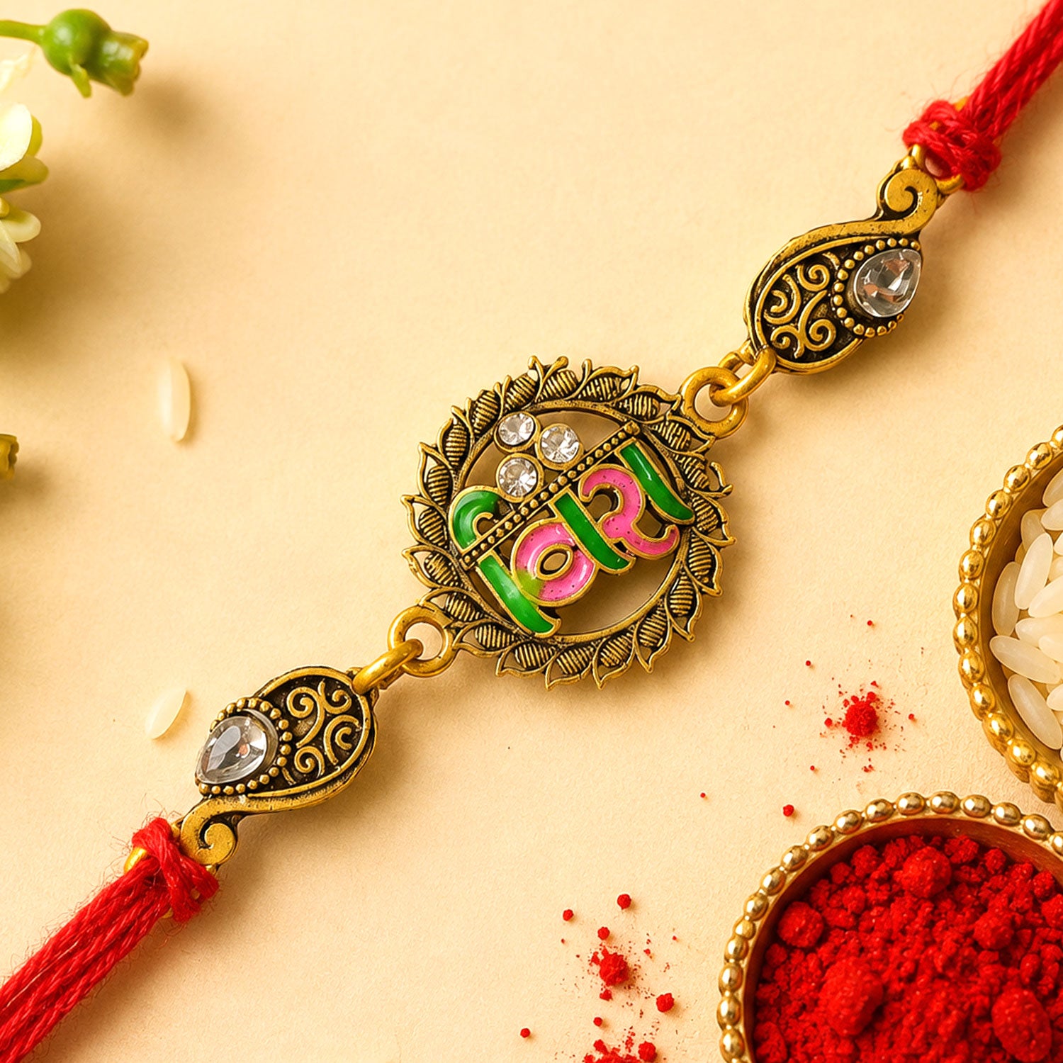 Antique Gold-Toned Veera Rakhi with Pink-Green Enamel, Crystal Accents & Red Thread