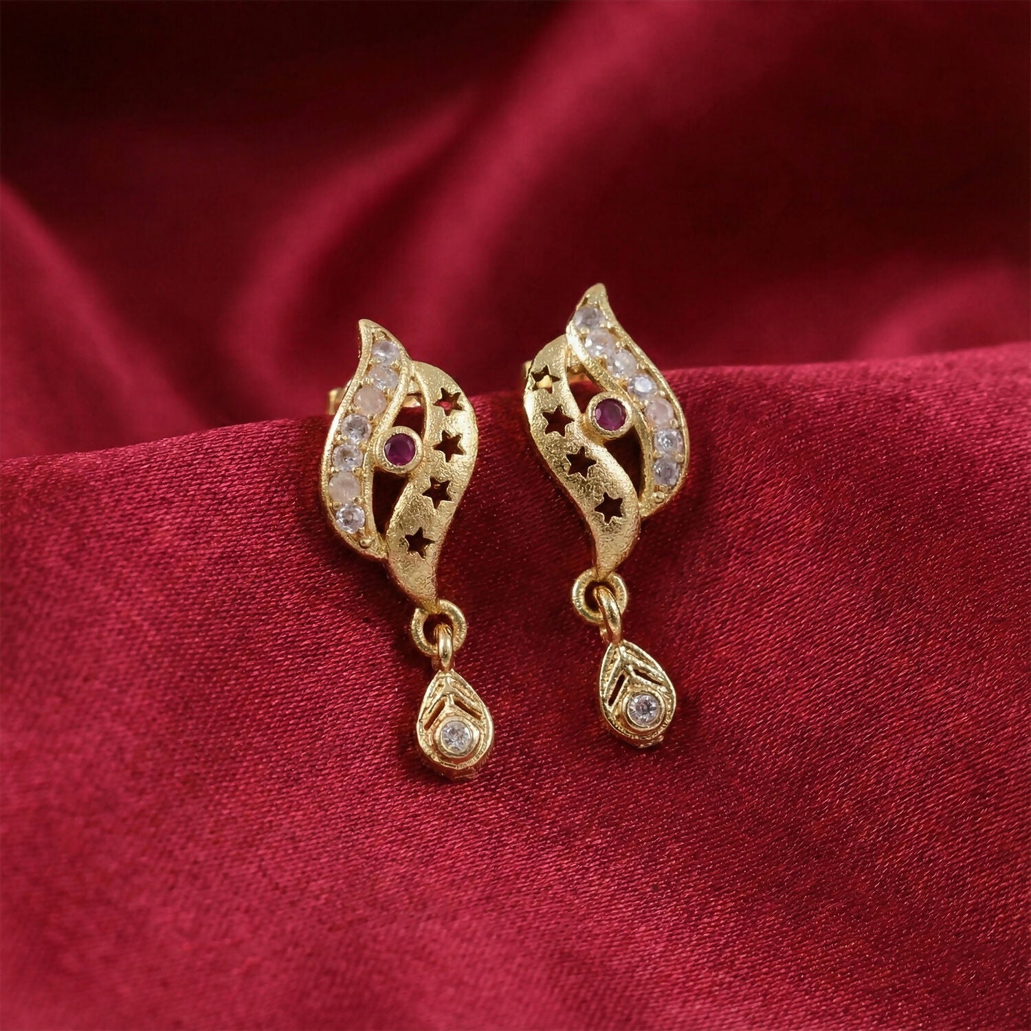 Star Cut Pattern Gold Finish Earrings With Crystal Detailing And Teardrop Charm