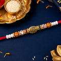 Red Thread Rakhi with Floral Gold Oval Charm and Multicolour Beads