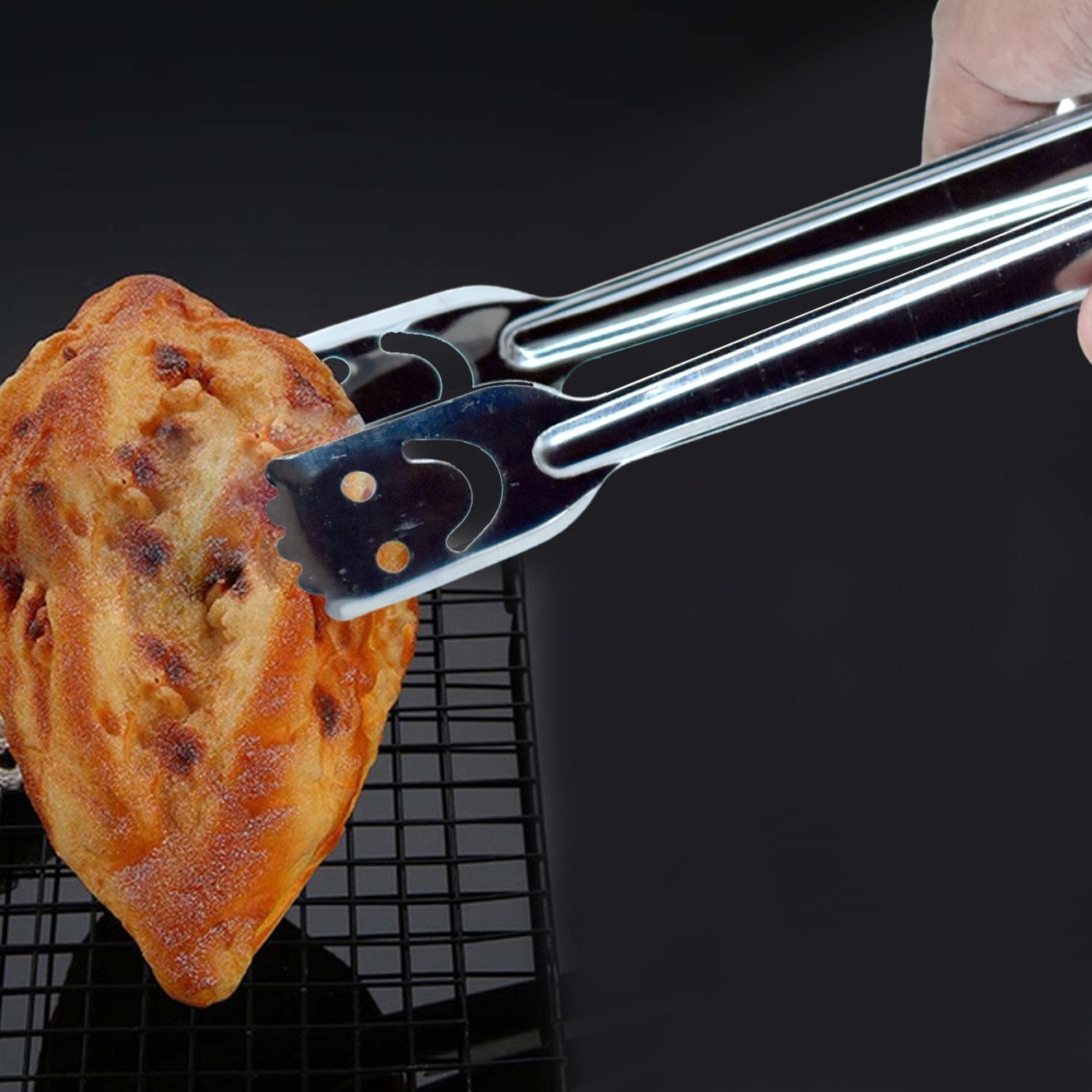 Stainless steel tongs, one piece, for everyday use in the kitchen.