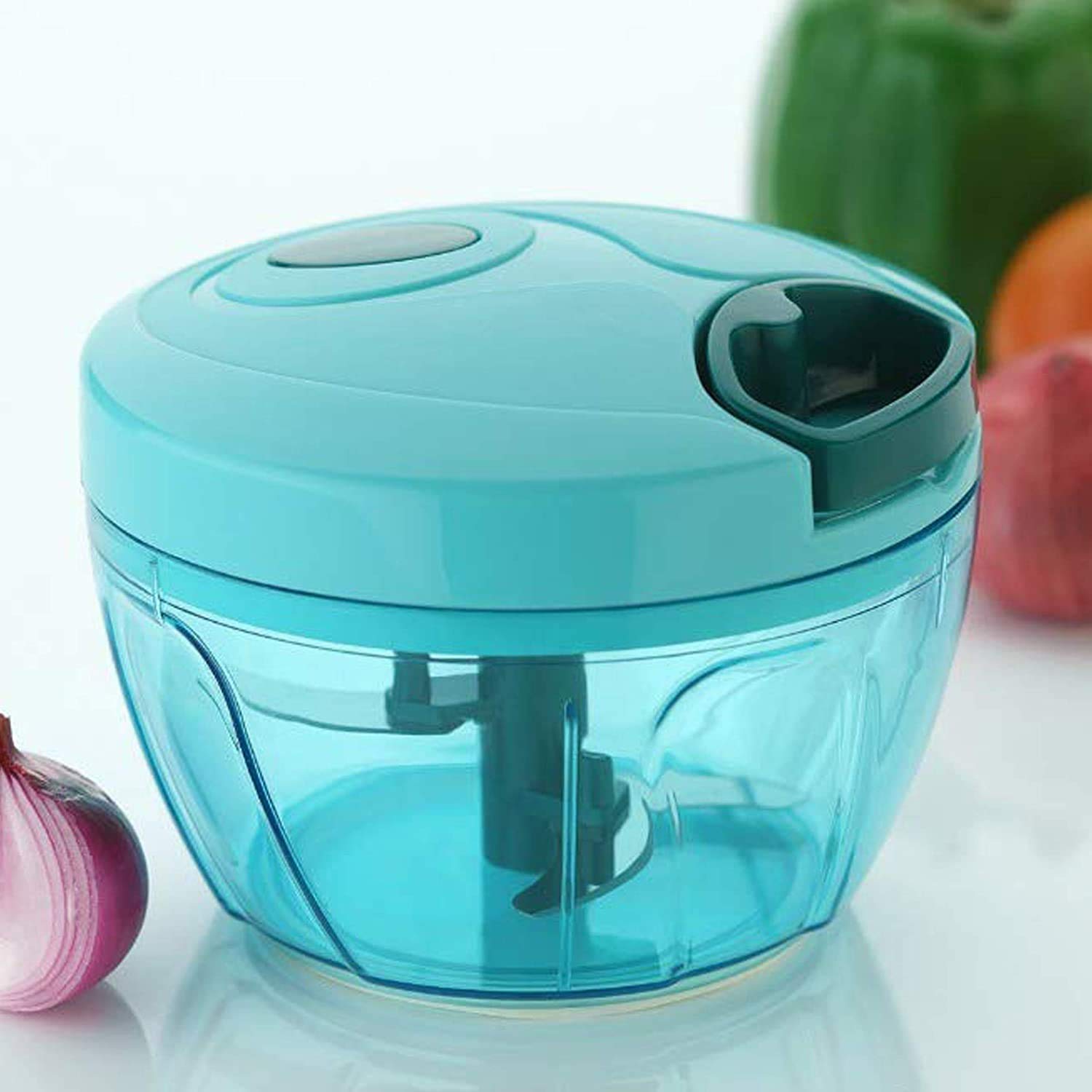 Compact hand-held vegetable chopper with stainless steel blades.