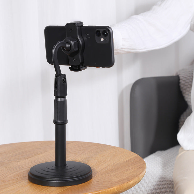 Desktop mobile stand, height adjustable, ideal for hands-free phone usage on tables.